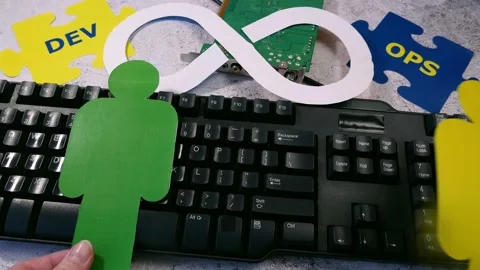 People symbols and puzzles with devops words. DevOps Concept for software eng Stock Footage 211807207