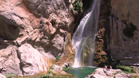 People take a bath under a waterfall during summer aerial drone view 動画素材 279569054