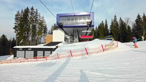 People take the elevator to the top station of the ski trail Stock Footage 219003858