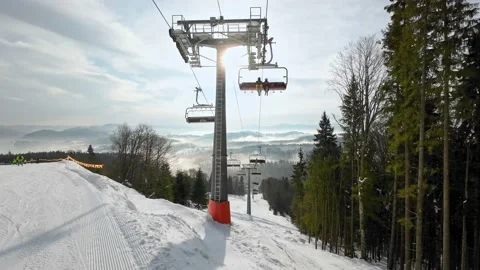 People take the elevator to the top station of the ski slope. Video stock 219003912