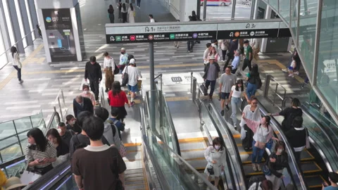 People take elevator to walk to Shibuya Hikarie from Shibuya Scramble Square Stock Footage 282641004