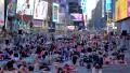 People take part in a mass yoga session in Times Square NYC HD Footage