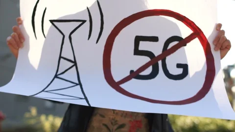 People take part to a protest against the 5G technology and 5G-compatible Stock Footage 129690288