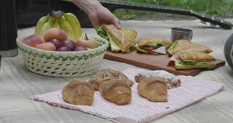 People Take Picnic Sandwiches From The Tablecloth Stock Footage
