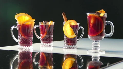People take from the table glasses with mulled wine and toast Video stock 78277314