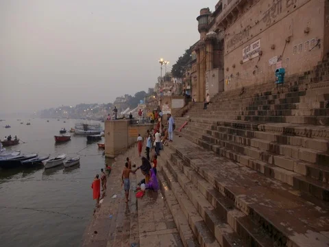 People taking bath and changing cloths on Munshi Ganga Ghat Varanasi Stock Footage 82221140