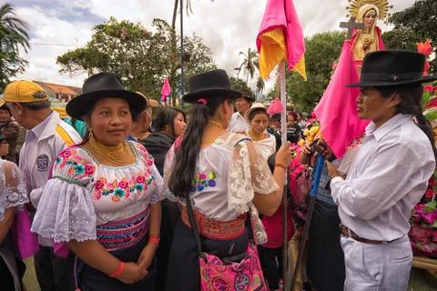 People taking a break from Easter procession parade in Cotacachi Ecuador Stock Photos