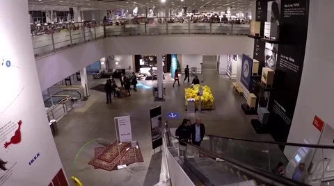 People taking escalator to the main floor inside Ikea store. Video stock 54540015