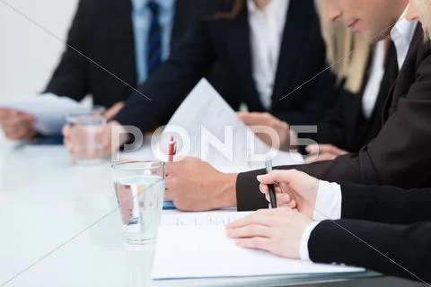 People taking notes in a meeting Stock Photos