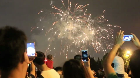 People taking photo in a firework performance show at Shanghai holiday Stock Footage 55544838