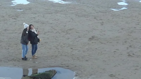 People taking selfieson the beach Stock Footage 114708985