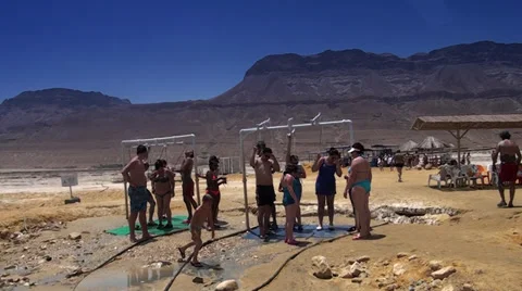 People taking a shower after bathing in the Dead sea, Israel, Middle East. Stock Footage 39672969