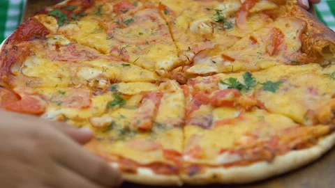 People taking slices of poor quality pizza from dirty board, risk of indigestion Stock Footage 95834229