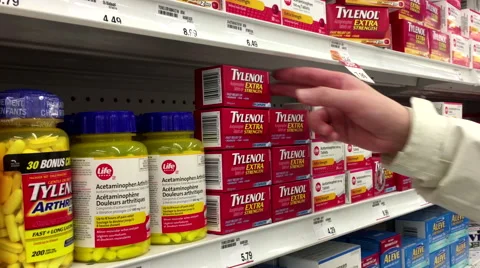 People taking Tylenol extra strengh inside Shoppers drug mart store Stock Footage 62941882