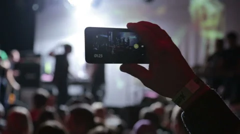 People taking video with touch smart phone during a music Stock Footage 50686767