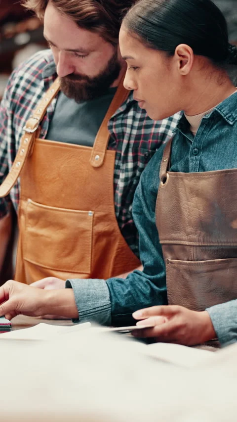 People, talk and sample in leather workshop with production plan, collaboration Stock Footage 332892679