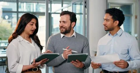 People, talking and document with tablet in office for planning, finance re.. Stock Photos