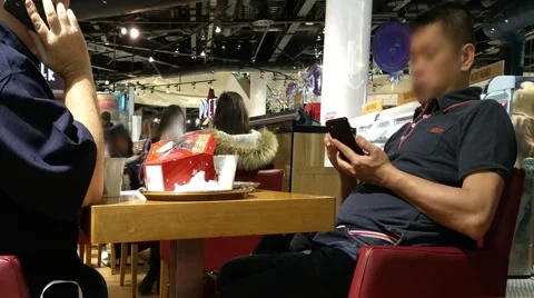 People  talking browsing  smartphone while sitting in cafe Stock Footage 58137643