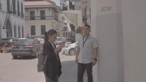 People talking on the side of the street and cars driving by in Panama Stock-Footage 343745931