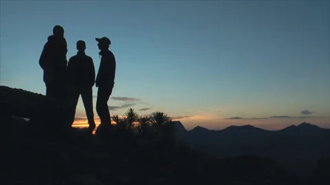People talking at sunset in the mountains Stock Footage 83694975