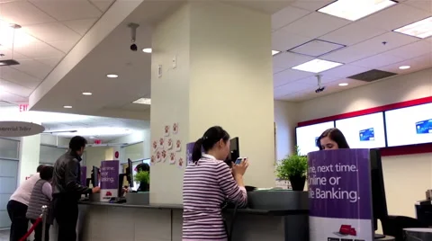 People talking to the teller inside Scotiabank Stock Footage 68594168