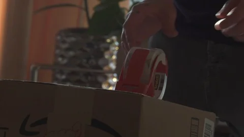 PEOPLE TAPING BOXES Stock-Footage 101265148