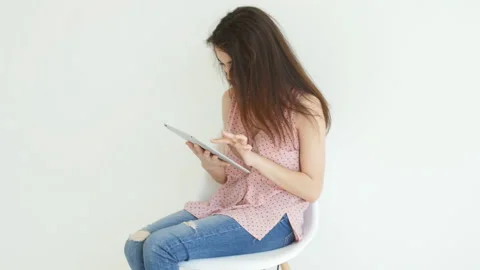 People, technology and interior concept. Happy young woman using tablet computer Stock Footage 94908739