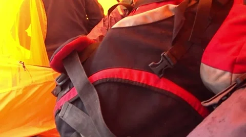 People in a Tent Sorted Things in Backpacks Stock Footage 61171745