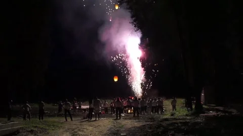 People with their backs to the camera are watching fireworks Stock Footage 163725959