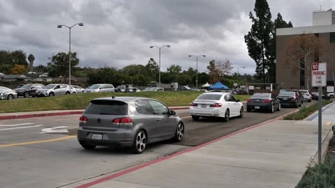 People in their Cars. Covid-19 Testing Site at Kaiser Permanente in San Diego. Stock Footage