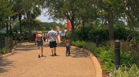 People in Theme Park Walking Along Pathway Stock Footage 23658945