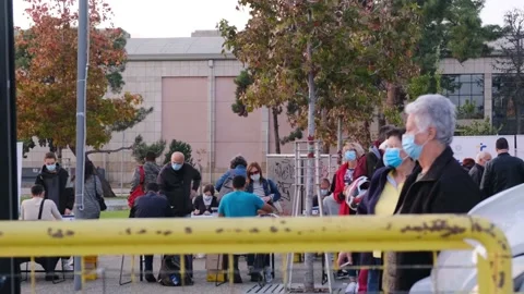 People in Thessaloniki waiting in queue to be tested for COVID-19 outdoors Stock Footage 142233816