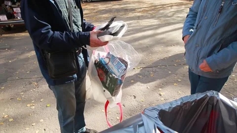 People throw away plastic packaging in containers and bags for recycling Stock Footage 246886038