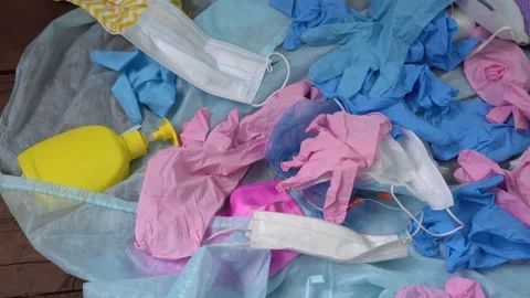 People throw away of used face masks, gloves and gowns Stock Footage 130326253