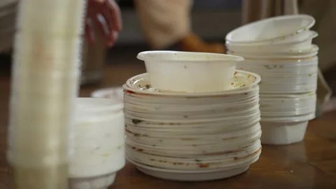 People throw away used plastic dishes 스톡 동영상 151842003