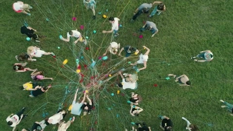 People throw balls of thread on the field aerial photography 스톡 동영상 134489555