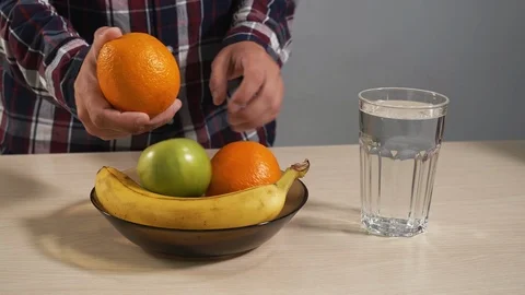 People throw different fruit plate closeup preparing for preparation 4K cocktail Stock Footage 114620228