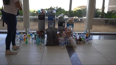 People throwing drinks in the trash 스톡 동영상 121507569