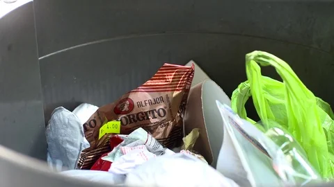 People throwing waste in the trash Stock Footage 81990259
