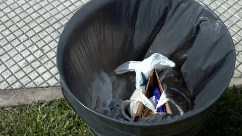 People throwing waste in the trash 스톡 동영상 81992146