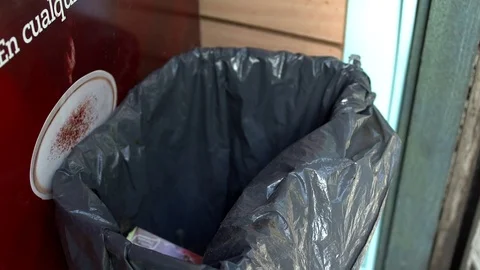 People throwing waste in the trash Stock Footage 82049003