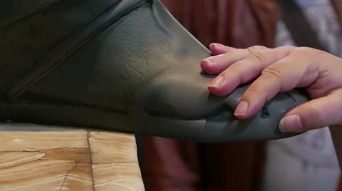 People touching statue leg Stock Footage 44560331