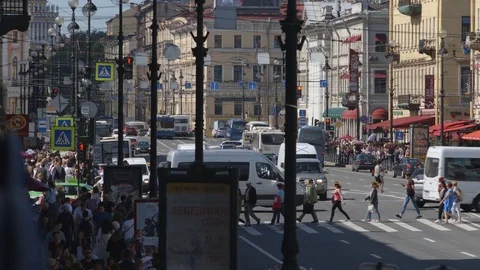 People traffic and car traffic of the Nevsky street in the summer Stock Footage 79449727