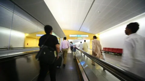 People on travelator in Dubai International Airport Stock Footage