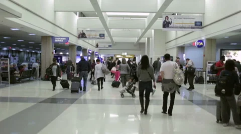 People, travelers walking at airport in LAX interior in LA Stock Footage 44112686