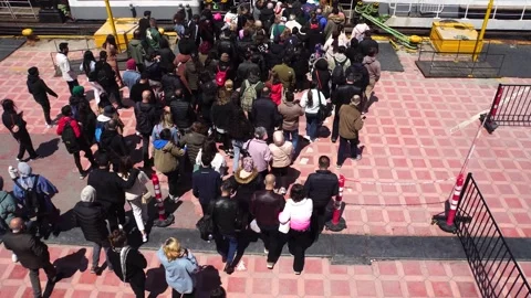 PEOPLE TRYING TO BOARD THE PASSENGER SHIP  KADIKOY ,ISTANBUL Stock Footage 240483358
