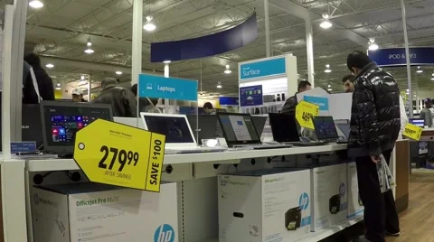 People trying new computer inside store Stock Footage 45706350