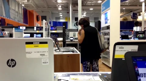 People trying new computer inside store Video stock 55316920