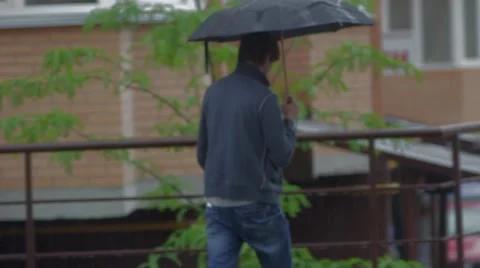 People with umbrellas under the rain Stock Footage 48675501