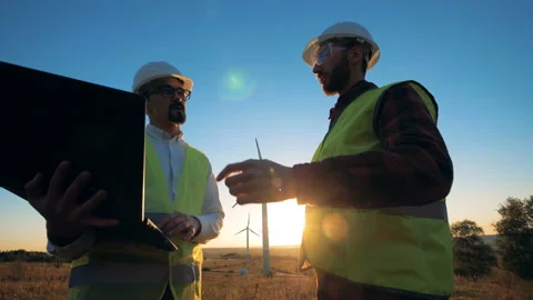 People in uniform checking windmills, close up. Stock Footage 96515842